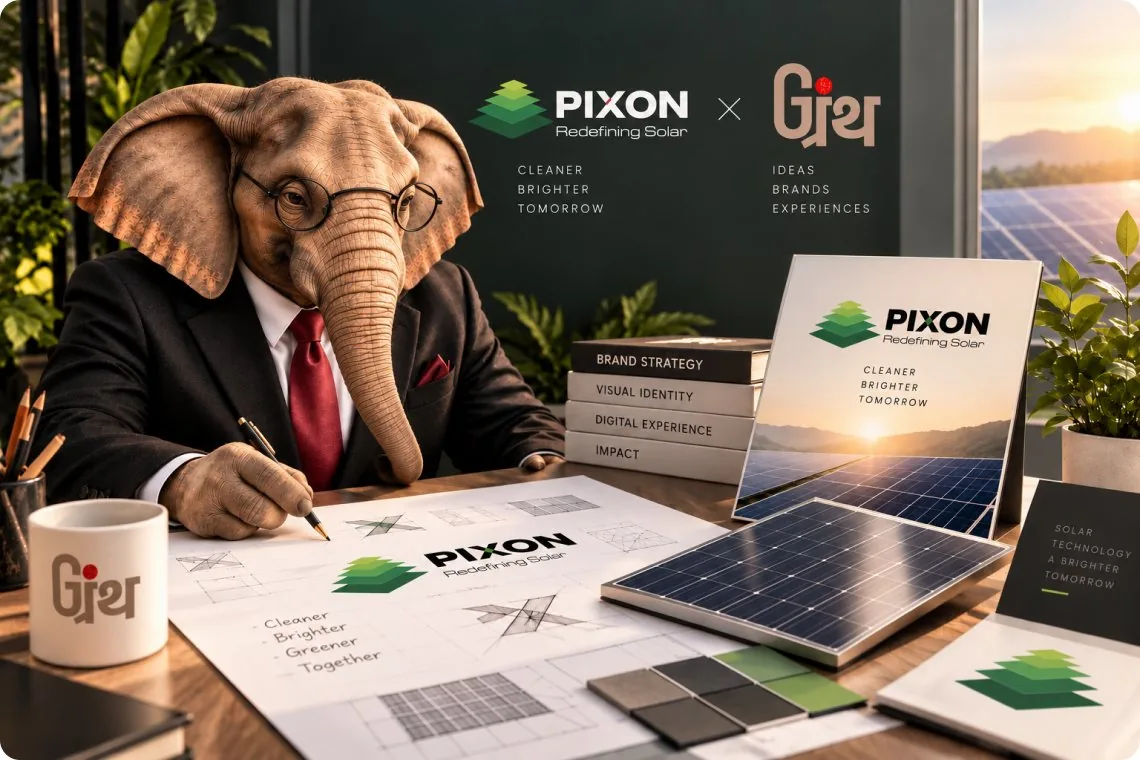Granth's elephant mascot at a desk sketching the new PIXON logo, surrounded by brand guidelines and solar panels